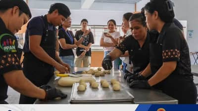Bakers prepare fortified bread during a NutriBaños benchmarking visit in Los Baños, Laguna.