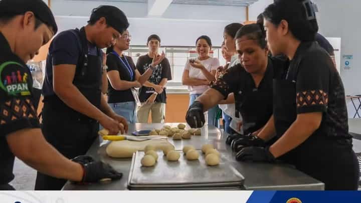 Bakers prepare fortified bread during a NutriBaños benchmarking visit in Los Baños, Laguna.