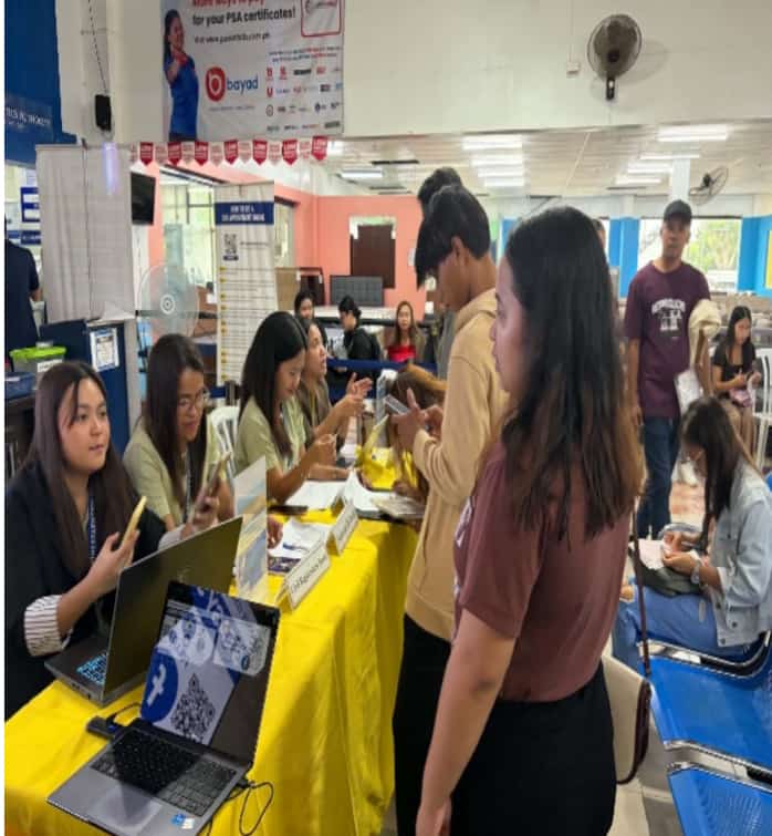 Visitors inquire about PSA services at information booths during an open house event in Lipa City, Batangas.