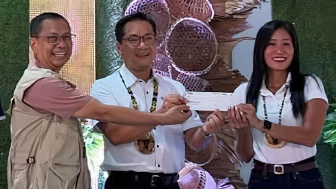 TOYOTA Motors Philippines Foundation operations manager Nelson Manglo (center) turns over the foundation’s P3-million donation to the Tamaraw Conservation Program, received by DENR-MIMAROPA regional executive director Felix Mirasol Jr. (left) and witnessed by MBCFI executive director Kathy Lene Cielo, with MBCFI serving as fund manager
