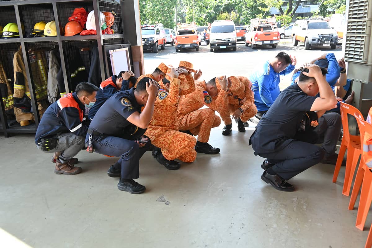 BUREAU of Fire Protection- Pasig members perform the “duck, cover and hold” protocol during the earthquake drill.