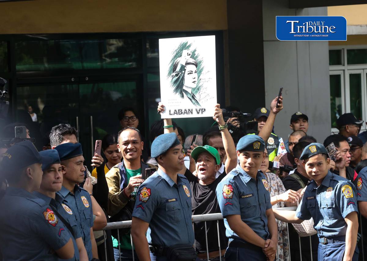 (October 09 2026) Vice President Sara Duterte supporters carrying a photo of VP Sara outside the Quezon City Regional Trial Court on Friday, October 9, 2026, to shows of their support during the arraignment of her three counts of grave threats case filed by the Department of Justice over her remarks against President Ferdinand “Bongbong” Marcos Jr., First Lady Liza Araneta-Marcos. Photo/Analy Labor