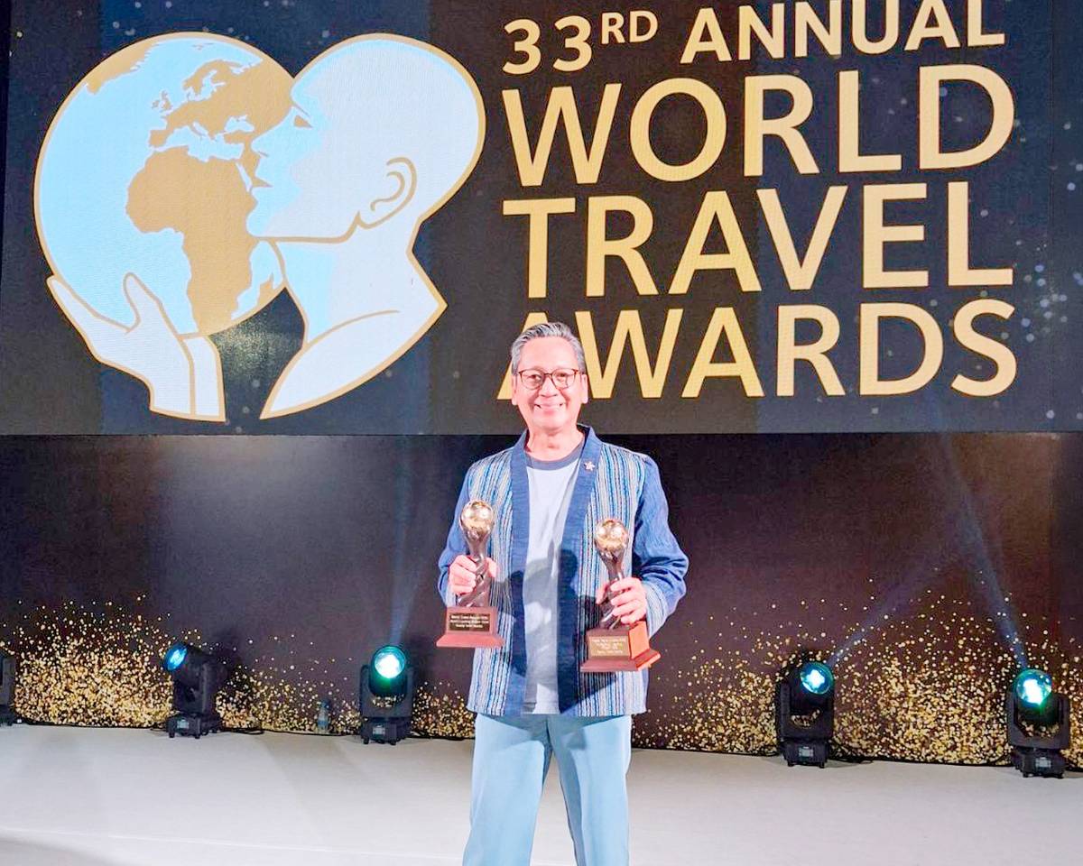 GENERAL manager Den Navarro holds Savoy Hotel Manila’s two World Travel Awards—Asia’s Leading Airport Hotel and Philippines’ Leading Airport Hotel—on behalf of the hotel and its entire team.