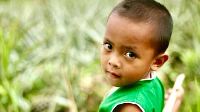 A Blaan boy in a pineapple field. Foothills of Mt. Matutum, South Cotabato.
