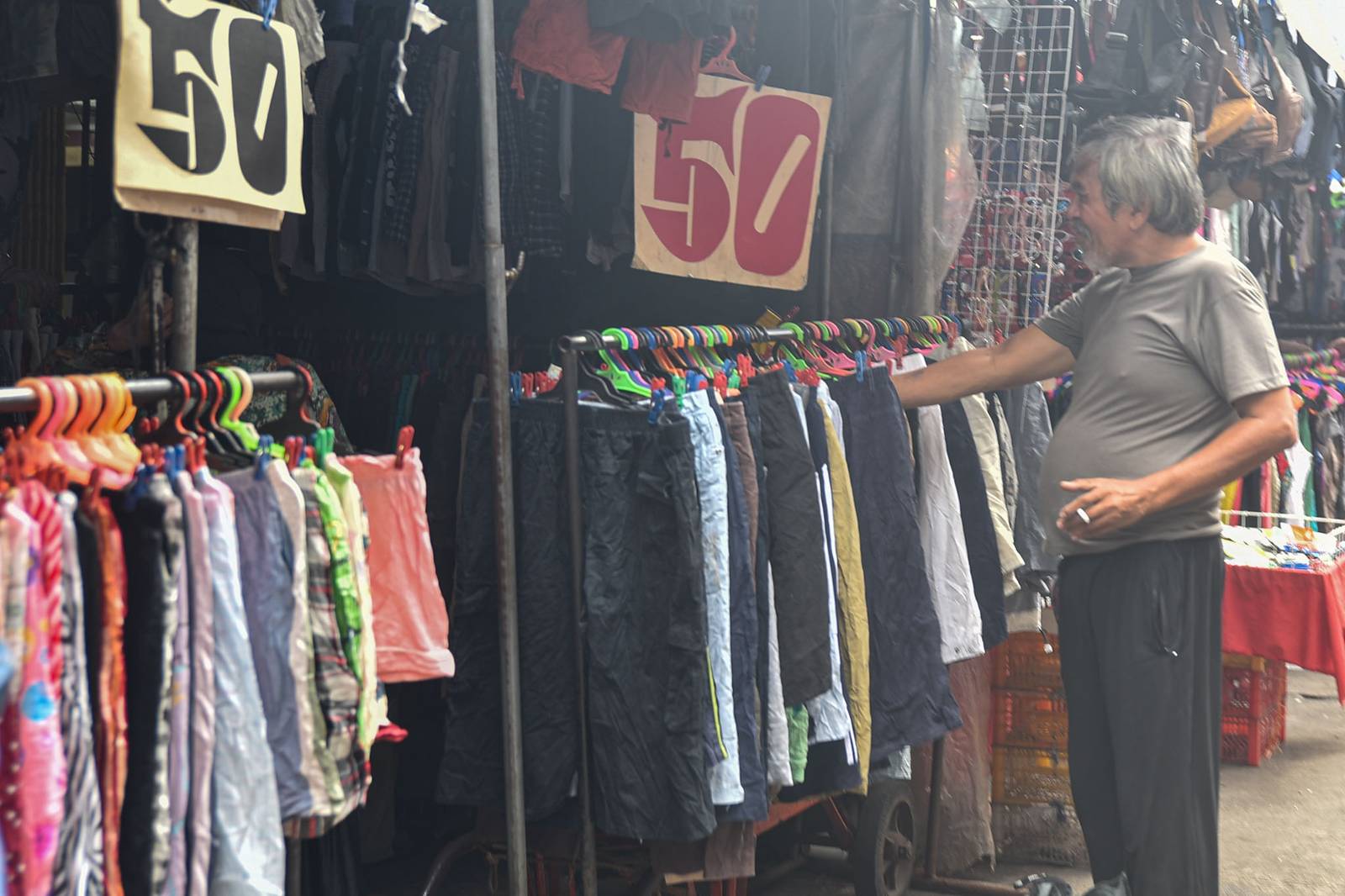 Thrifted clothes are displayed for sale along the streets of Quiapo, Manila, as vendors offer secondhand garments at affordable prices on October 10.

Filipinos turn to ukay-ukay shops and street stalls to find quality clothing at lower prices. l Zedrich Xylak Madrid