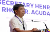 SECRETARY Henry Aguda