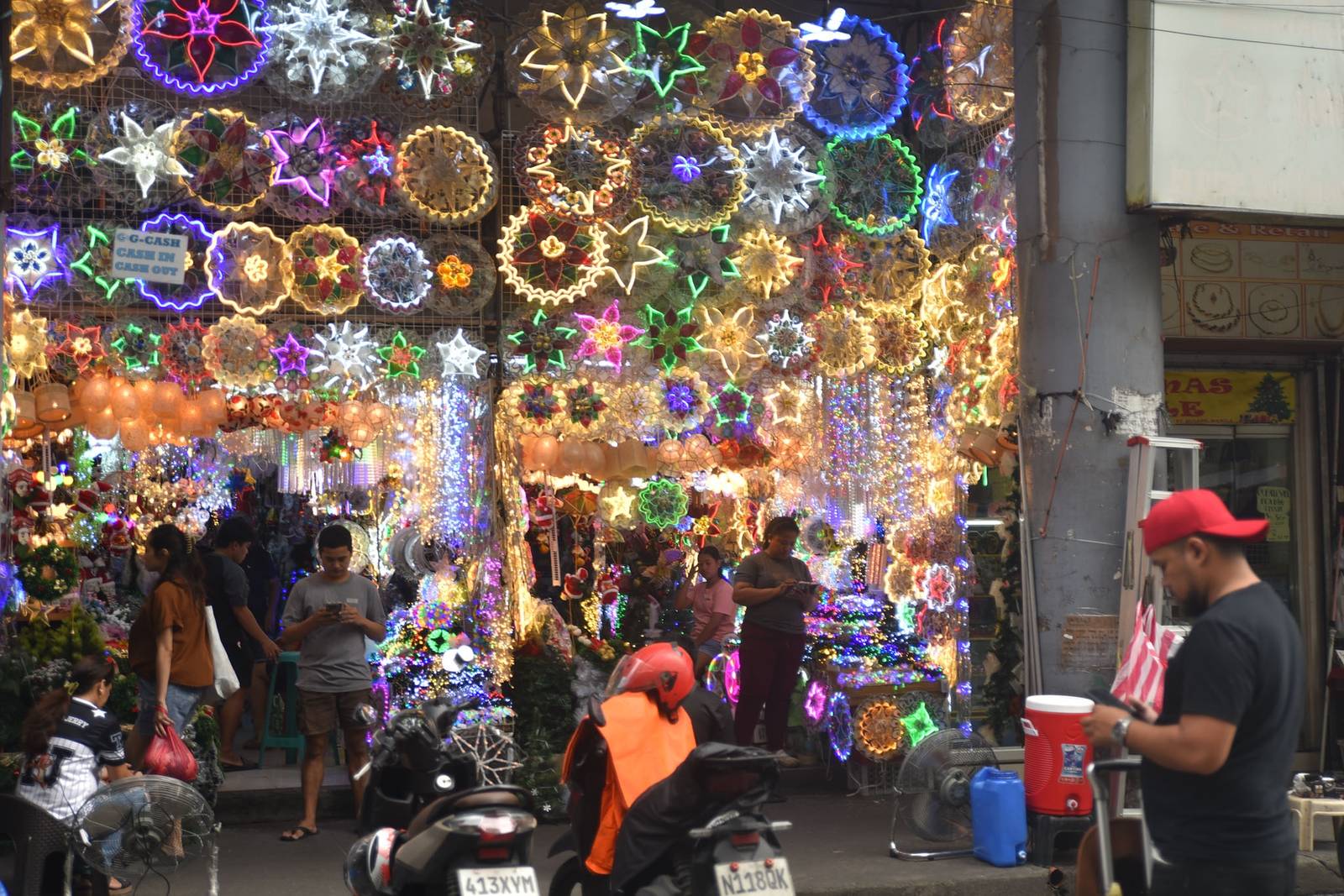 Christmas lights and traditional ‘parols’ illuminate Carriedo Street in Quiapo, Manila, on October 10, as the Philippines embraces the ‘ber months,’ marking the start of the countdown to the Christmas season. | Zedrich Xylak Madrid