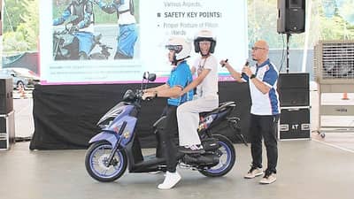 INSTRUCTORS from the Honda Safety Driving Center demonstrate proper motorcycle passenger safety during an interactive learning session.