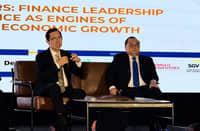 BANK of the Philippine Islands president and CEO TG Limcaoco (left) and Philippine National Bank president and CEO Edwin Bautista speak at the Financial Executives Institute of the Philippines’ 58th annual conference on Friday at the Sheraton hotel in Pasay.