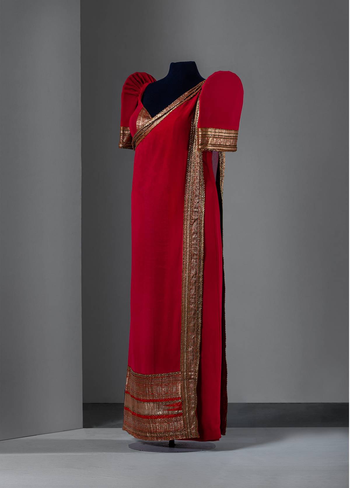 Ben Farrales (1932-2021)
Indian-inspired red crepe terno with beaded metallic gold trim, c. 1990s. Worn and donated by Bambi Lammoglia Harper.