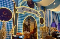 BAVARIAN-INSPIRED decorations in blue and white adorn the entrance to the German Club Manila’s Oktoberfest celebration.