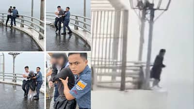 Personnel from Headquarters Regional Maritime Unit 7 assist a 14-year-old student after rescuing her from the outer guardrail of the Marcelo Fernan Bridge in Cebu.