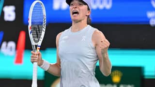 Poland's Iga Swiatek celebrates beating Switzerland's Belinda Bencic in their women’s singles match at the Wuhan Open tennis tournament in Wuhan, central China’s Hubei province on October 9, 2025.