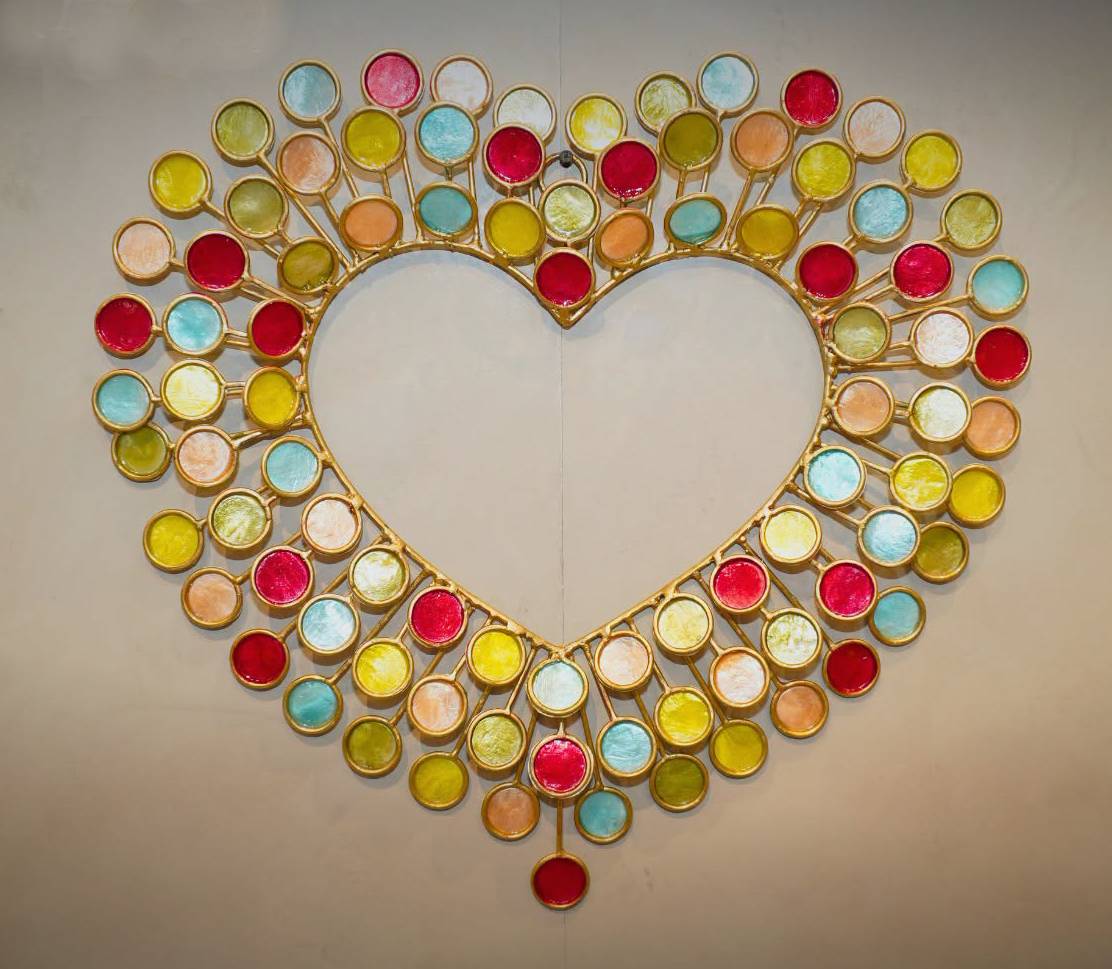 HEART-SHAPED wall sculpture.