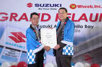 YUKIO Sato (left), Suzuki Philippines general manager for After-Sales Service and Marine Division, and Antonio Teng, senior vice president, treasurer and director of Wheels Inc., display the certificate to operate during the reopening of Suzuki Auto Manila Bay.