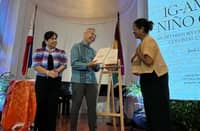 MARIE Joy Rosal presents NHCP chairman Regalado Trota Jose Jr. with a copy of her book as executive director Carminda Arevalo looks on.