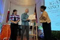 MARIE Joy Rosal presents NHCP chairman Regalado Trota Jose Jr. with a copy of her book as executive director Carminda Arevalo looks on.