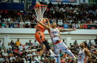 CHOLO Añonuevo dunks over Brandon Wilson during the Quezon Huskers’ 99-85 win over the Zamboanga SiKat in the South Division quarterfinals of the MPBL 2026 Season on Saturday.