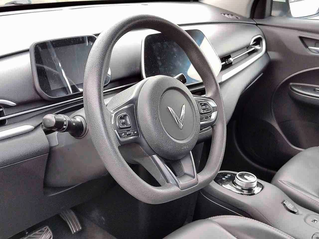 ROTARY gear selector sits on the center console, while the digital displays and infotainment screen are positioned within easy view and reach of the driver.