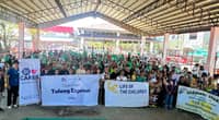 ORGANIZERS, volunteers and beneficiaries assemble for a group photo during the ‘Operation Tulong Express’ relief operation.