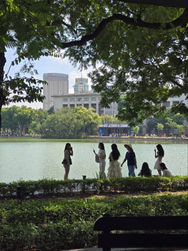 LOCALS enjoying early morning serenity of Hoan Kiem Lake
