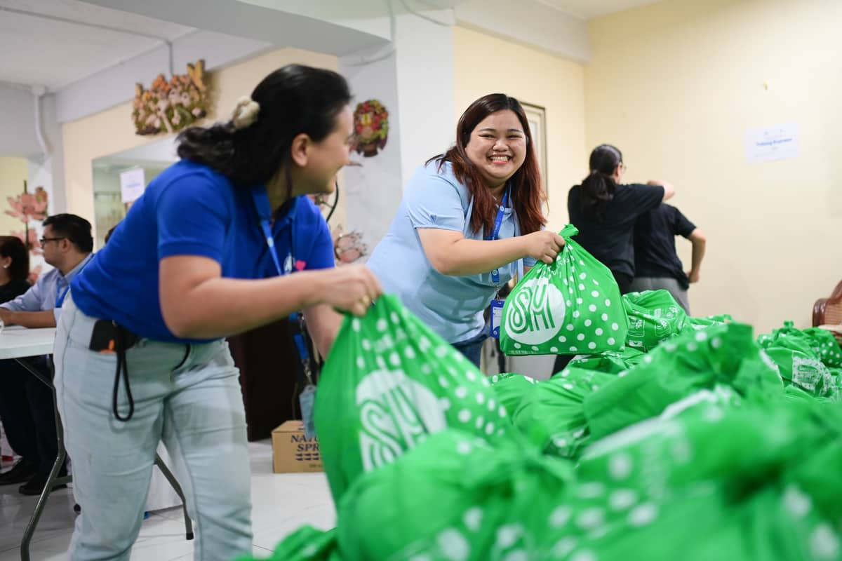 VOLUNTEERS pack and stack relief bags ahead of an Operation Tulong Express distribution, work that moves faster when everyone knows their task.
