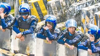 POLICE in riot gear barricade a portion of Mendiola in Manila as farmers from various provinces converge at the area to protest against Pax Silica and other issues they claimed threaten agricultural communities.