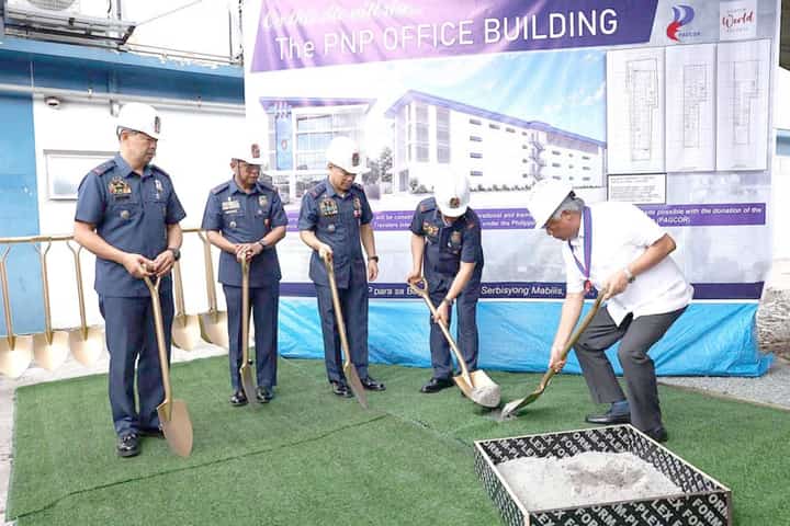 OFFICIALS from the Philippine National Police and Philippine Amusement and Gaming Corp. chairperson and CEO Alejandro H. Tengco (right) lead the ceremonial groundbreaking for the new four-story PNP office building at Camp BGen Rafael T. Crame in Quezon City on Wednesday.