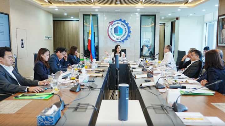 PEZA Board Chair and DTI Secretary Cristina Roque (center) presides over the PEZA Board meeting on 14 October 2026.