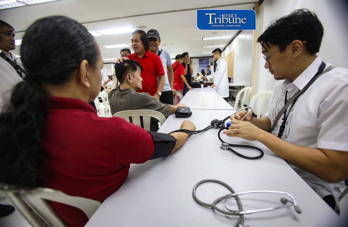 (October 22 2026) Members of the Media queue  for the autograph of Public Attorney’s Office Chief Persida Rueda-Acosta, as PAO Chief give her book “Laws of Life” for free, and they also avail the free check up and medicine, during a medical mission at the PAO Main Office at the DOJ Agencies Building in Quezon City as part of their 54th anniversary celebration, providing free legal assistance and counsel to indigent litigants across the country. Photo/Analy Labor