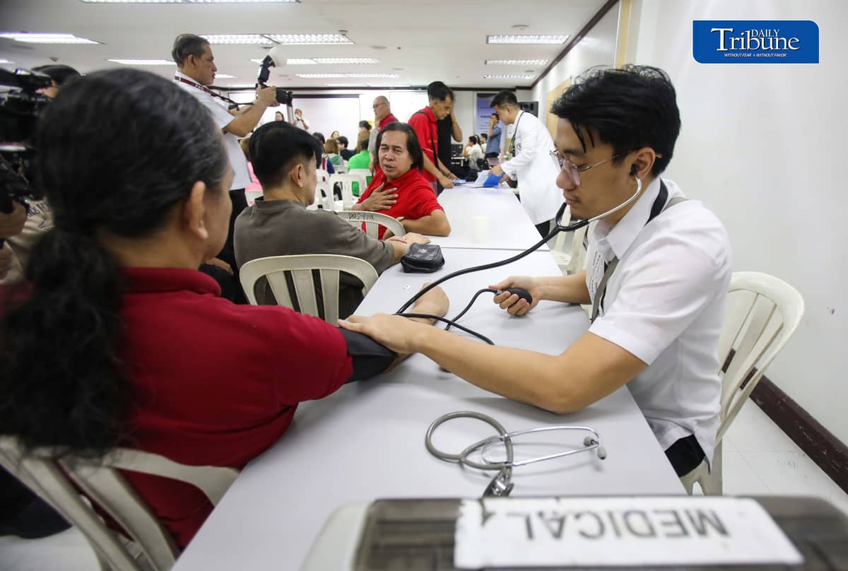 (October 22 2026) Members of the Media queue  for the autograph of Public Attorney’s Office Chief Persida Rueda-Acosta, as PAO Chief give her book “Laws of Life” for free, and they also avail the free check up and medicine, during a medical mission at the PAO Main Office at the DOJ Agencies Building in Quezon City as part of their 54th anniversary celebration, providing free legal assistance and counsel to indigent litigants across the country. Photo/Analy Labor