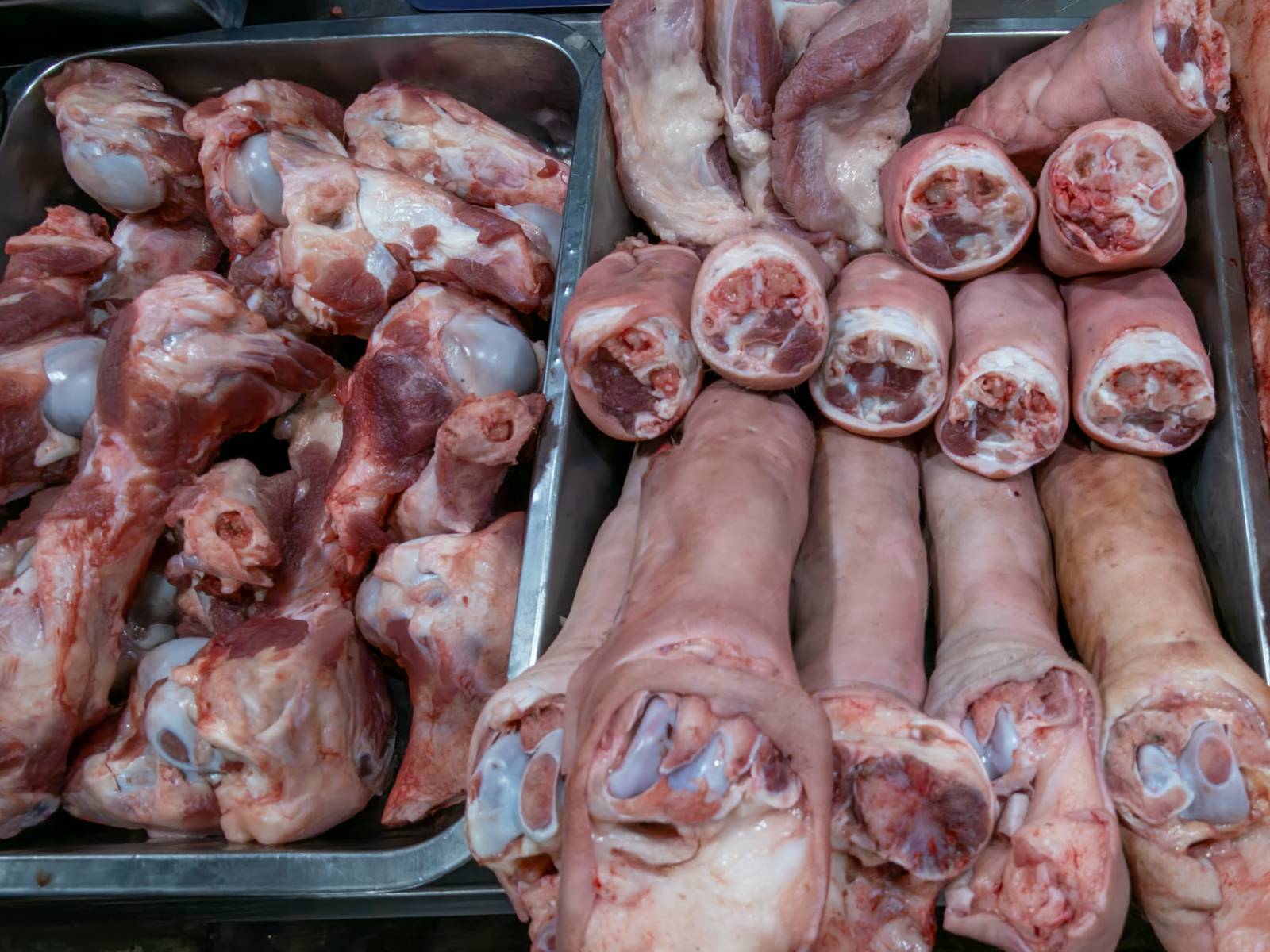 Pork cuts are displayed at a meat section of a public market in Manila on 22 October 2026. Local hog raisers nationwide have launched a three-day “pork holiday” from 22 to 24 October, voluntarily suspending live hog deliveries to markets to protest mounting industry losses, rising production costs and competition from imported pork. The protest aims to urge the government to review import policies and strengthen protection for the domestic hog industry.