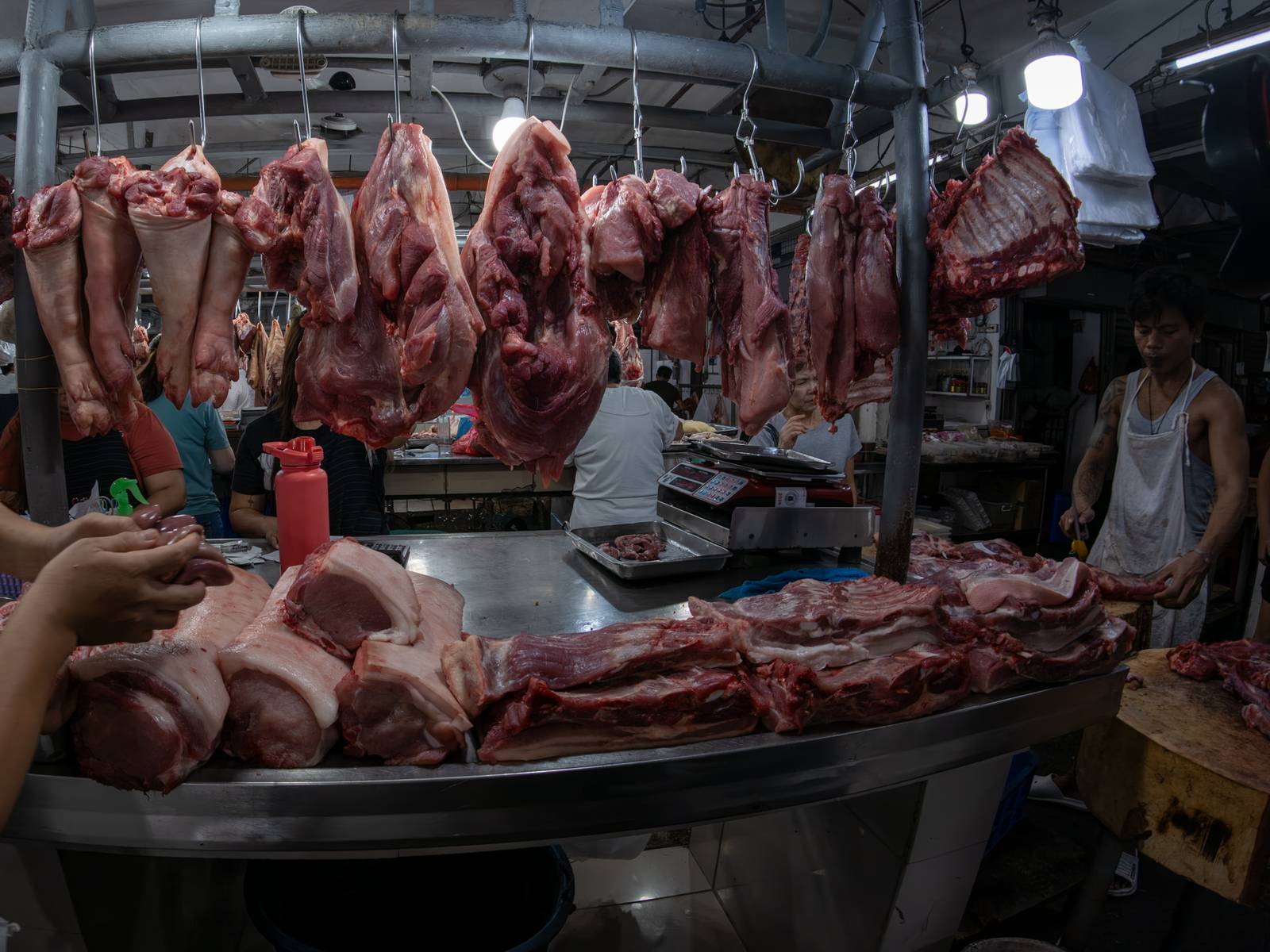 Pork cuts are displayed at a meat section of a public market in Manila on 22 October 2026. Local hog raisers nationwide have launched a three-day “pork holiday” from 22 to 24 October, voluntarily suspending live hog deliveries to markets to protest mounting industry losses, rising production costs and competition from imported pork. The protest aims to urge the government to review import policies and strengthen protection for the domestic hog industry.