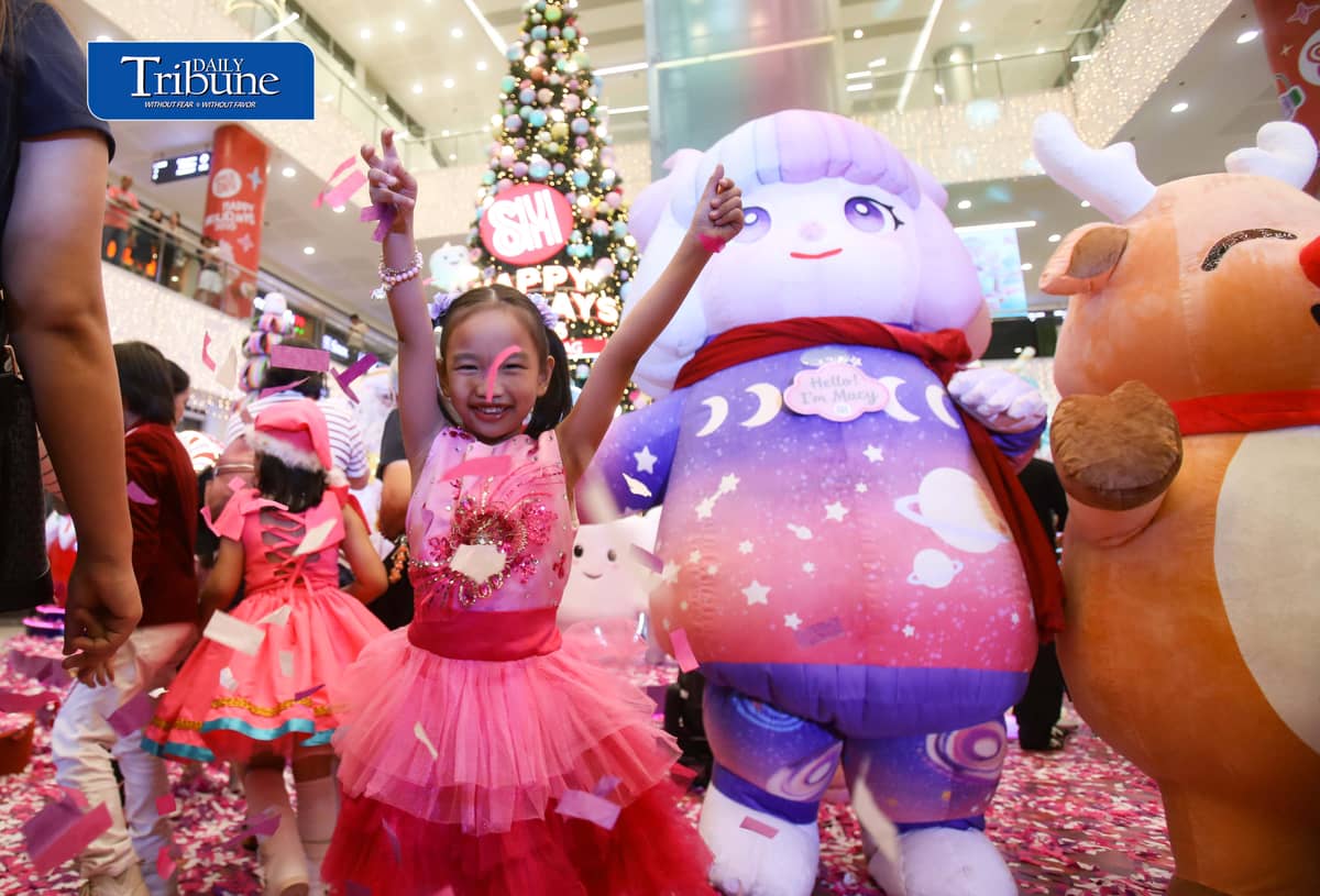 (October 22 2026) Parents with their kids in colorful costumes interact with Sant Claus and other mascots as they enjoy the candy-inspired holiday decorations and pastel-colored Christmas tree during the Macy’s Holiday Candyland Christmas launch at SM City Masinag in Antipolo, Rizal on Wednesday night, October 21 2026. Photo/Analy Labor