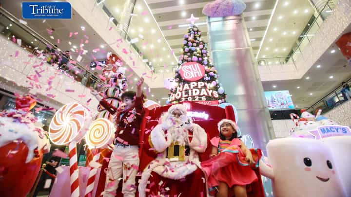 (October 22 2026) Parents with their kids in colorful costumes interact with Sant Claus and other mascots as they enjoy the candy-inspired holiday decorations and pastel-colored Christmas tree during the Macy’s Holiday Candyland Christmas launch at SM City Masinag in Antipolo, Rizal on Wednesday night, October 21 2026. Photo/Analy Labor