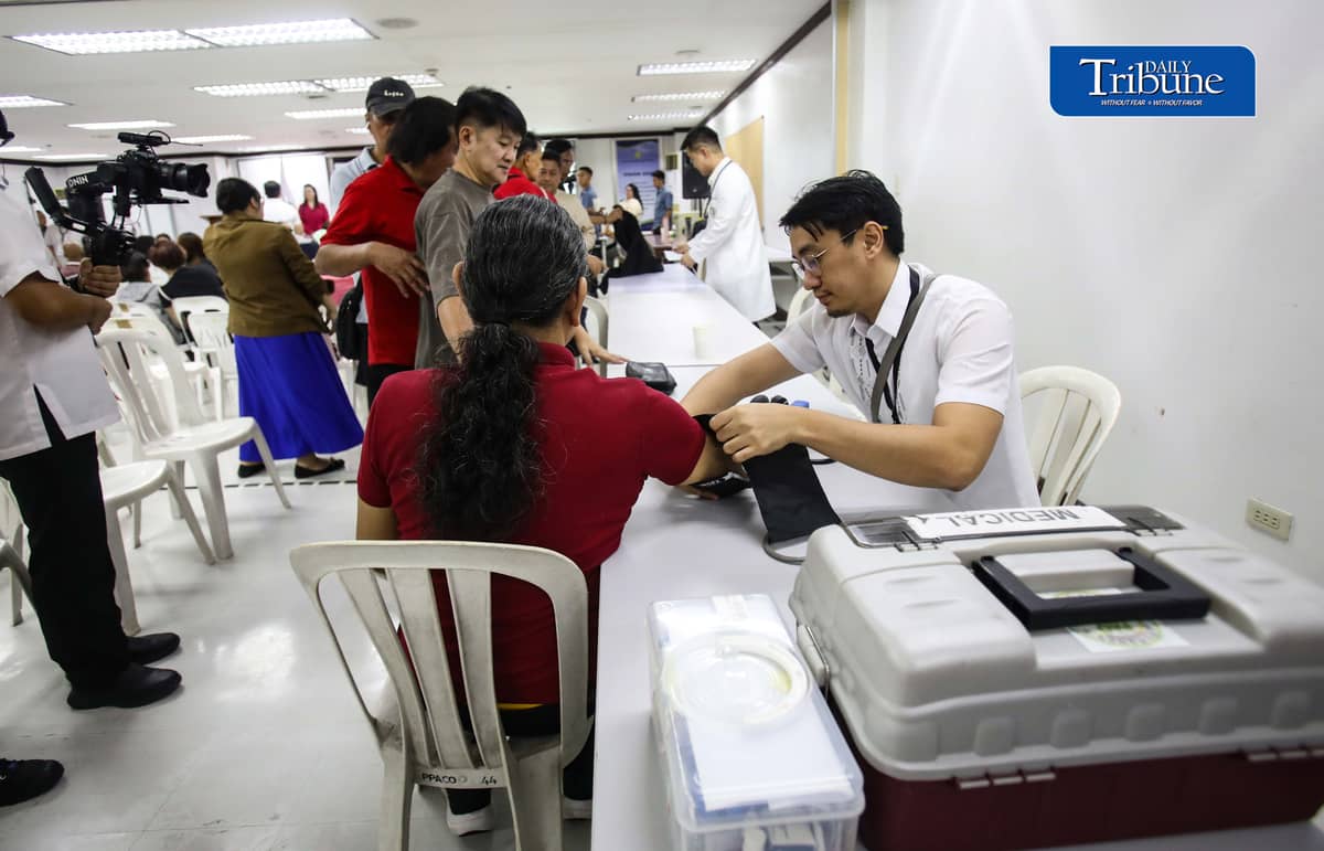 (October 22 2026) Members of the Media queue  for the autograph of Public Attorney’s Office Chief Persida Rueda-Acosta, as PAO Chief give her book “Laws of Life” for free, and they also avail the free check up and medicine, during a medical mission at the PAO Main Office at the DOJ Agencies Building in Quezon City as part of their 54th anniversary celebration, providing free legal assistance and counsel to indigent litigants across the country. Photo/Analy Labor