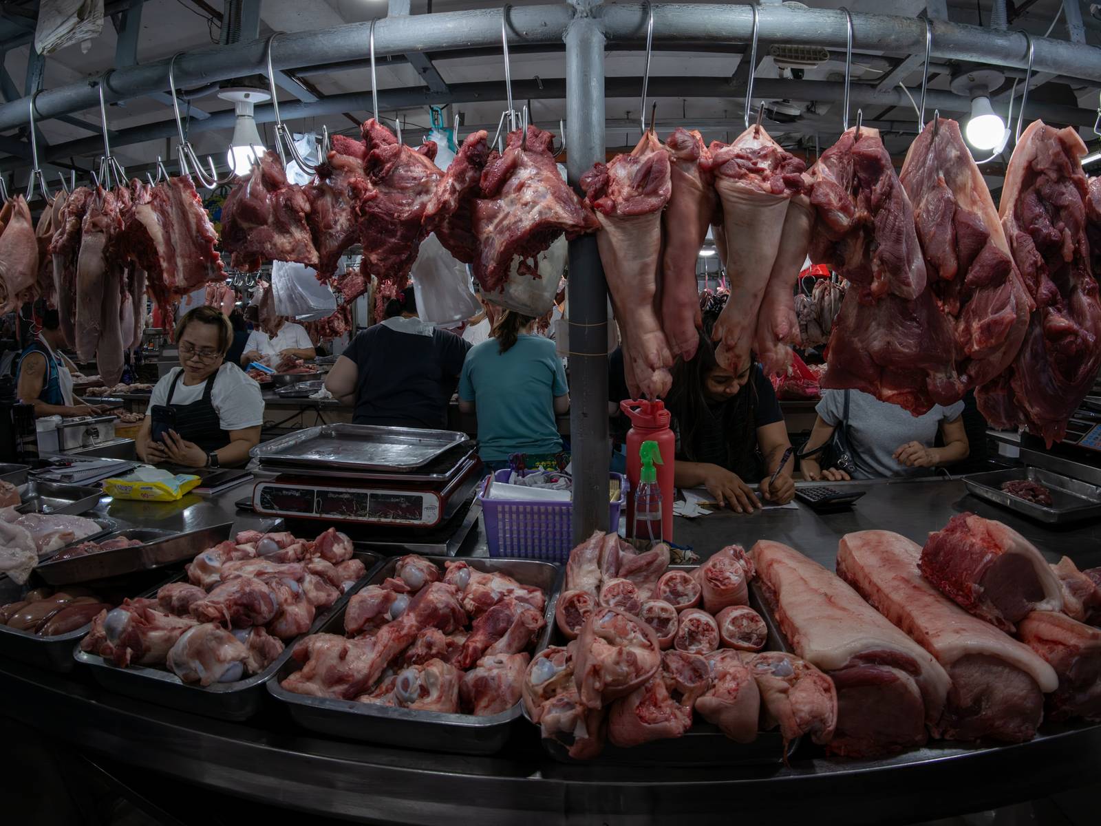 Pork cuts are displayed at a meat section of a public market in Manila on 22 October 2026. Local hog raisers nationwide have launched a three-day “pork holiday” from 22 to 24 October, voluntarily suspending live hog deliveries to markets to protest mounting industry losses, rising production costs and competition from imported pork. The protest aims to urge the government to review import policies and strengthen protection for the domestic hog industry.