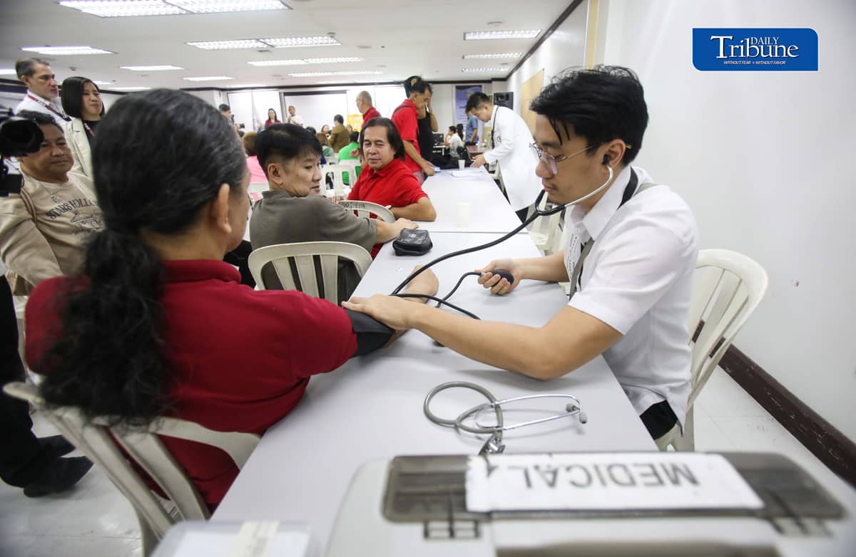 (October 22 2026) Members of the Media queue  for the autograph of Public Attorney’s Office Chief Persida Rueda-Acosta, as PAO Chief give her book “Laws of Life” for free, and they also avail the free check up and medicine, during a medical mission at the PAO Main Office at the DOJ Agencies Building in Quezon City as part of their 54th anniversary celebration, providing free legal assistance and counsel to indigent litigants across the country. Photo/Analy Labor