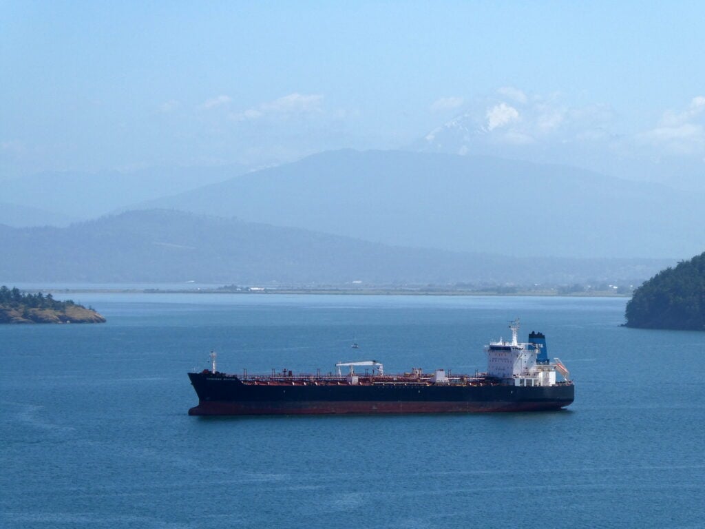 Oil spills from tanker as ships attacked 