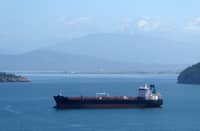 Oil spills from tanker as ships attacked