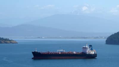 Oil spills from tanker as ships attacked