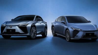 LEXUS features its fully electric RZ SUV (left) and ES 350h Luxury hybrid sedan at the 14th Philippine Electric Vehicle Summit in Pasay City.