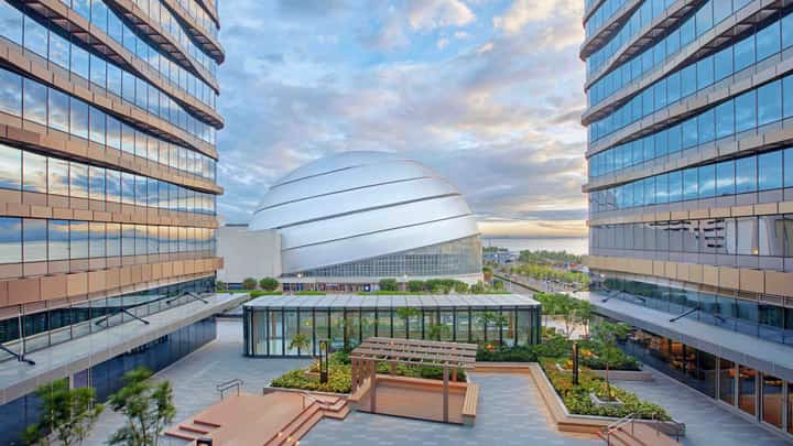 LANSON Place Mall of Asia is hosting the TLI Radio Halloween Festival in its courtyard, featuring 8 DJs performing against a Manila Bay backdrop.