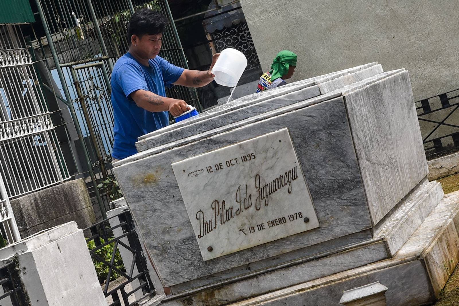 Gravekeepers and caretakers clean and maintain gravestones at the Manila North Cemetery in Manila, on October 24.

The Manila North Cemetery expects around 2 million visitors for this year's Undas. l Zedrich Xylak Madrid