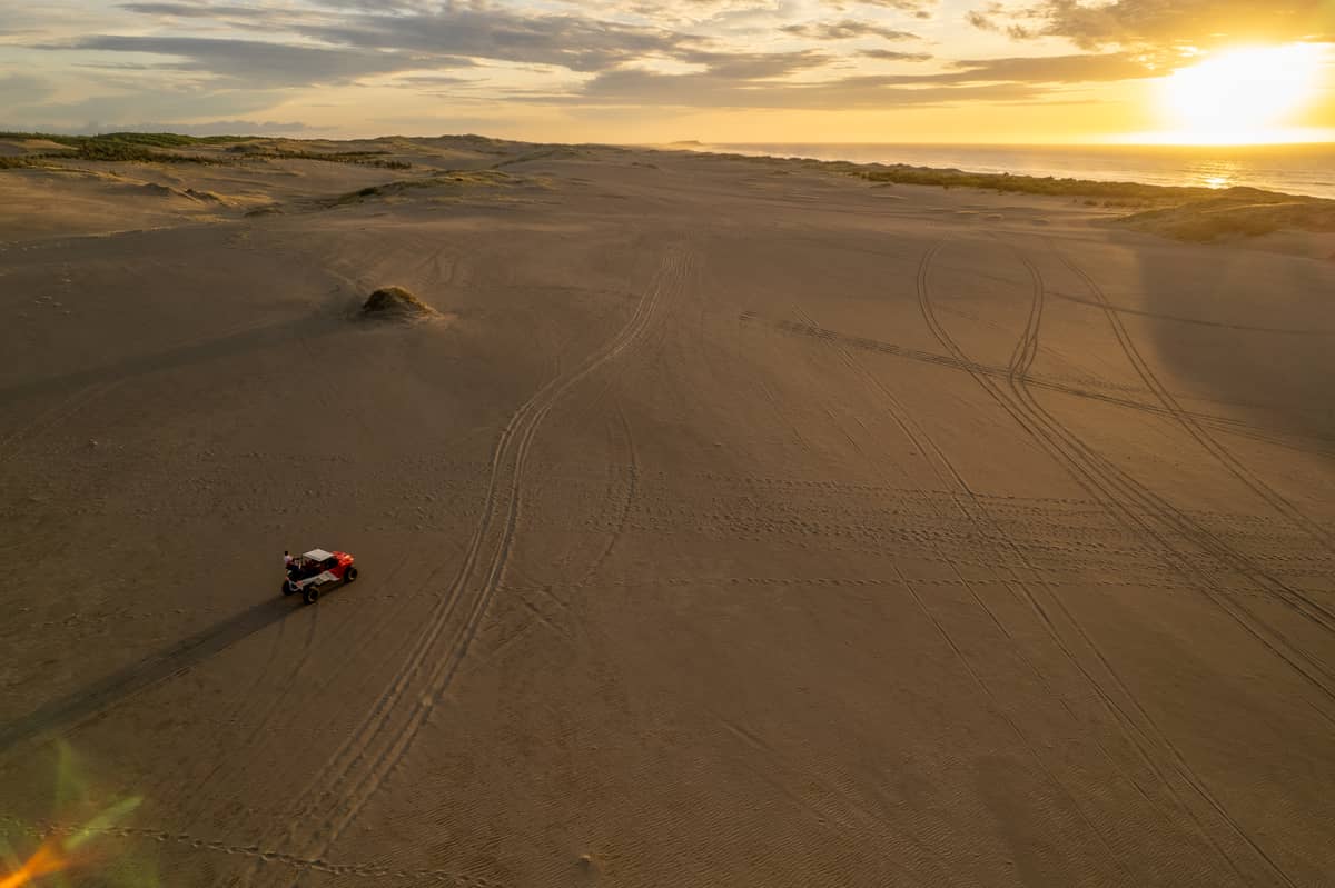 TIRE tracks cut across the sand at Paoay, contrasting with the wind-shaped patterns that cover the dunes.