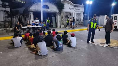 MANILA police screen individuals during nighttime patrols at the Manila North Cemetery on Friday as part of intensified Oplan Galugad operations ahead of Undas 2026.
