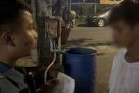 A QUEZON City police officer questions alias ‘Arjay,’ 26, identified as the leader of the Santos Criminal Gang and the city’s seventh most wanted person, following his arrest.