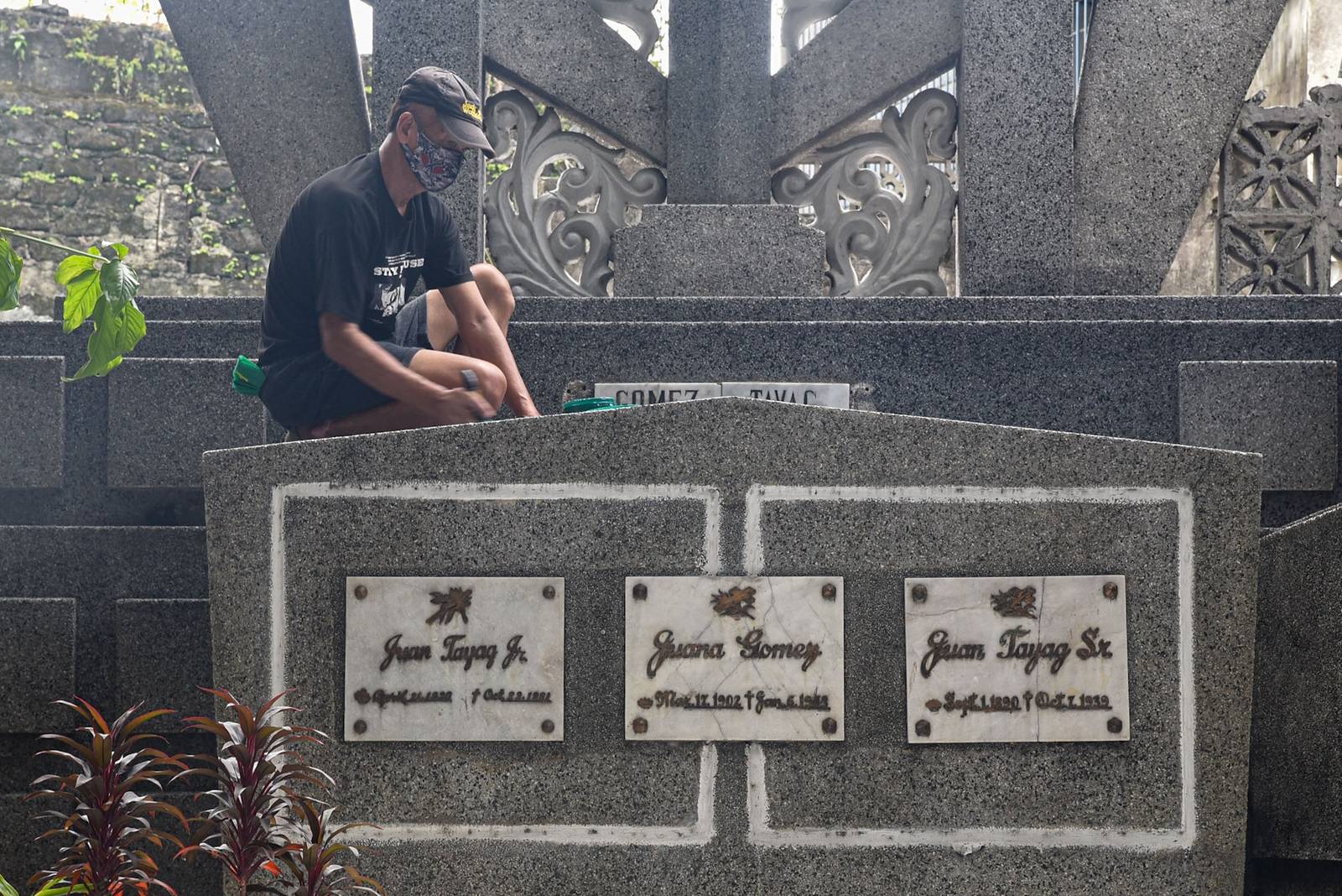 Gravekeepers and caretakers clean and maintain gravestones at the Manila North Cemetery in Manila, on October 24.

The Manila North Cemetery expects around 2 million visitors for this year's Undas. l Zedrich Xylak Madrid