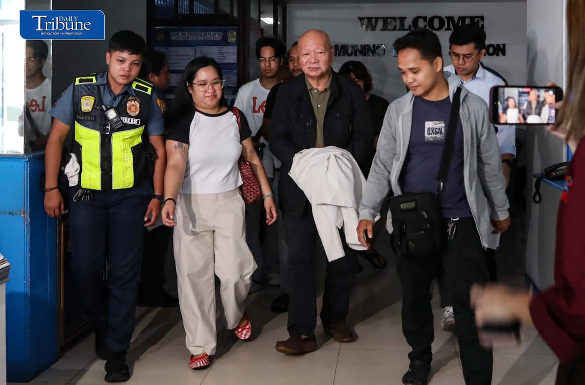 (October 24 2026) Journalist Philip Lustre being escorted by the Quezon City Police station 10 for the medical examination, after he was arrested for the alleged cyberlibel complaint, Lustre was arrested after he attended the Saturday News Forum, on Saturday October 24 2026. The  arrest warrant was issued by a Davao City court. Photo/Analy Labor