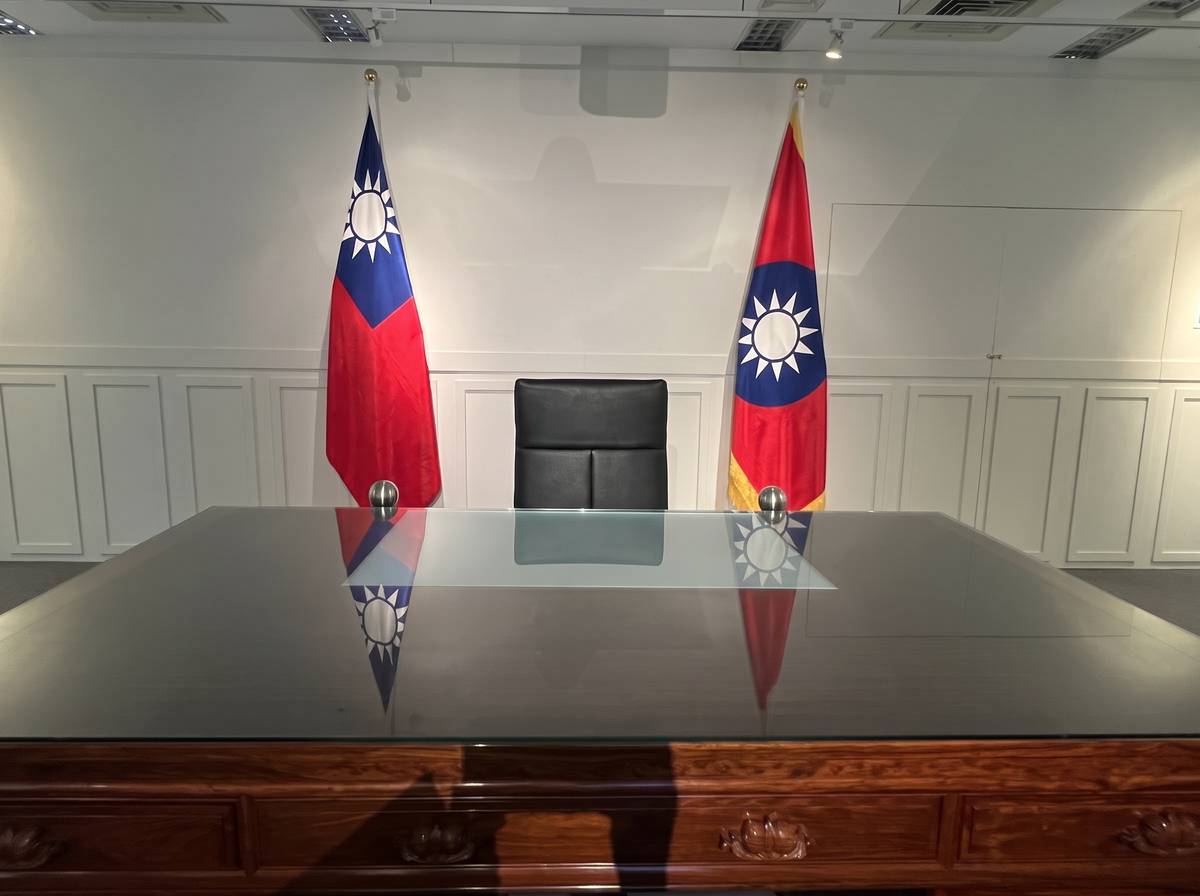 A REPLICA presidential desk flanked by the national flags of the Republic of China (Taiwan) inside the Presidential Office Building in Taipei, Taiwan.